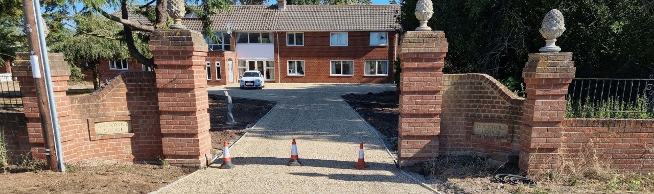 This is a photo of a newly installed chip and tar driveway, installed by Rothwell Driveways